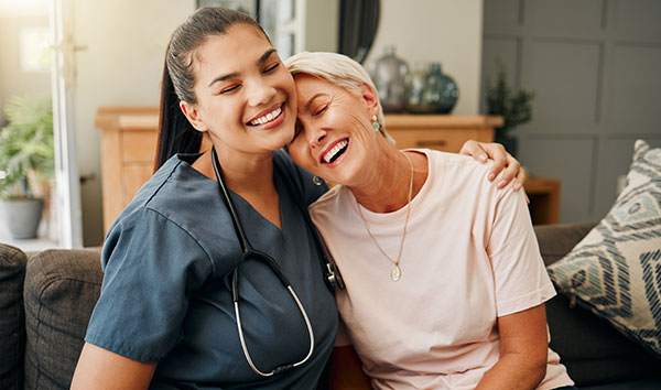 Doctor laughing with older patient